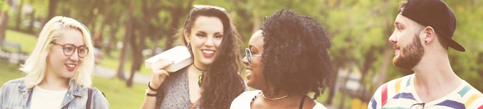 young adults having a conversation outdoors