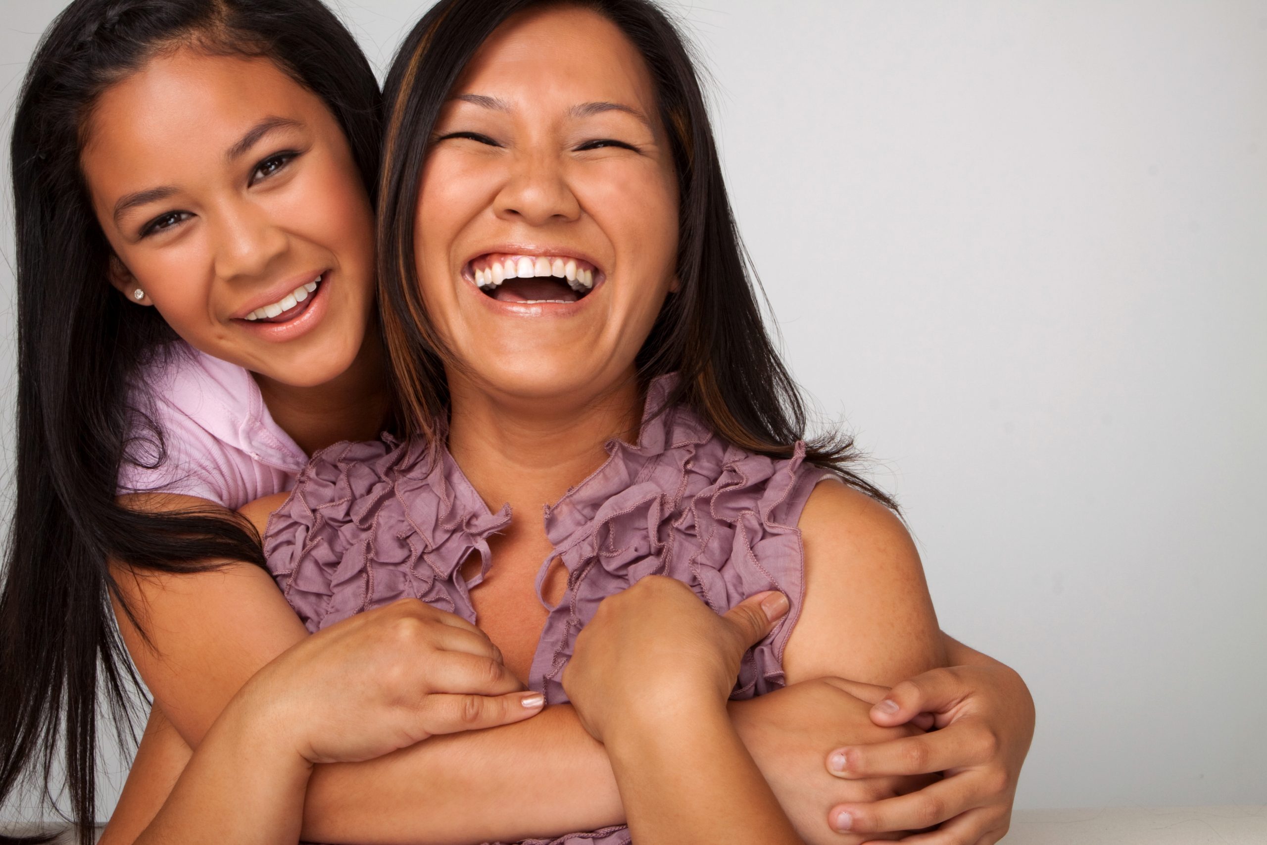 Foster mom and daughter smiling