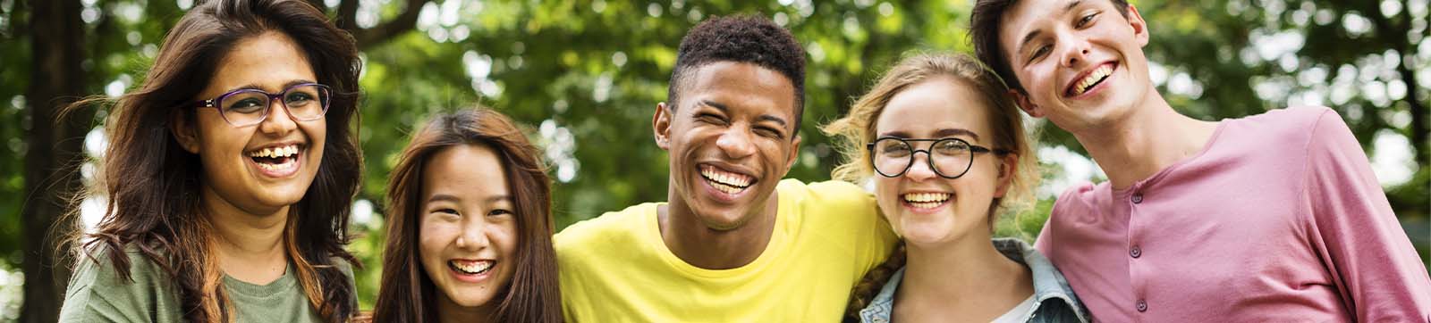 group of mixed ethnicity teenagers smiling and laughing